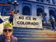 Cartoon of the Colorado Capitol with legal paperwork and a gavel labeled immigration bills